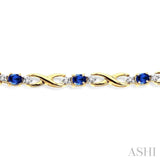 4x3 MM Oval Cut Sapphire and 1/10 Ctw Single Cut Diamond Bracelet in 10K Yellow Gold