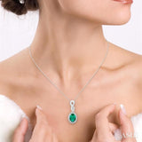 6x4 MM Oval Cut Emerald and 1/10 Ctw Round Cut Diamond Pendant in 10K White Gold with Chain